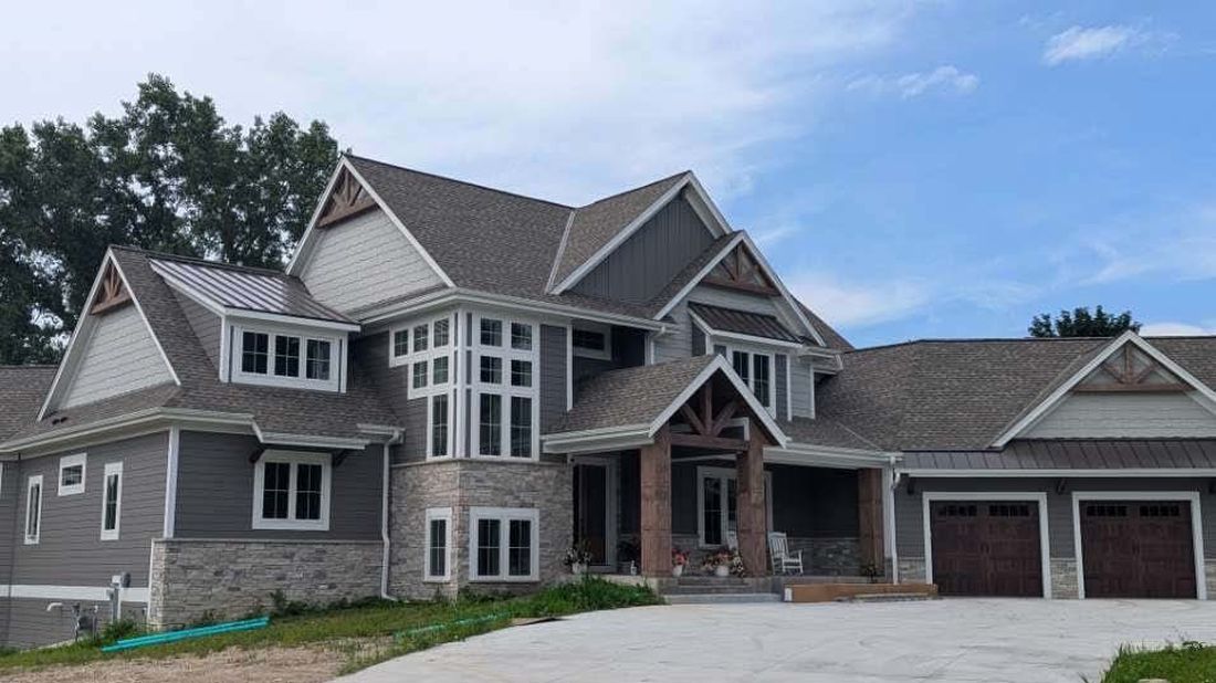 Completed large craftsman home siding project