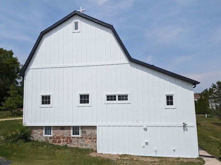 Completed barn-style building siding project
