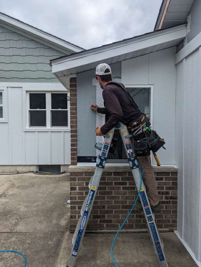 Michael installing siding on a Southeastern Wisconsin home